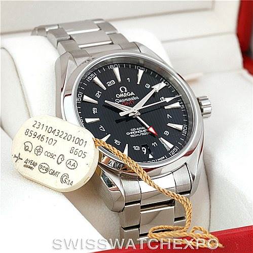 The Omega Aqua Terra 231.10.43.22.01.001 Men
s Stainless Steel Black Dial 231.10.43.22.01.001 Men
s Stainless Steel Black Dial watch is shown at a 3/4 angle, displaying its face, bezel, and bracelet, with a tag attached.