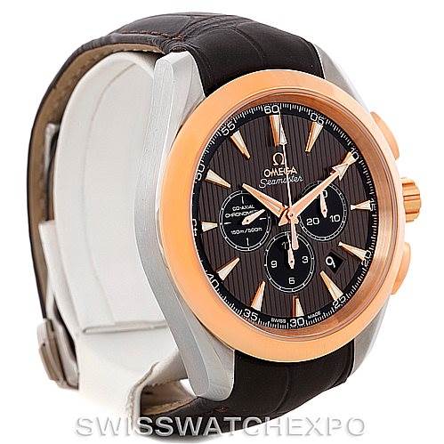 The image shows an angled side view of the Omega Aqua Terra 231.23.44.50.06.001 Men's Steel and Gold (two tone) Grey Dial 231.23.44.50.06.001 Men's Steel and Gold (two tone) Grey Dial watch, highlighting its face, bezel, and leather strap.