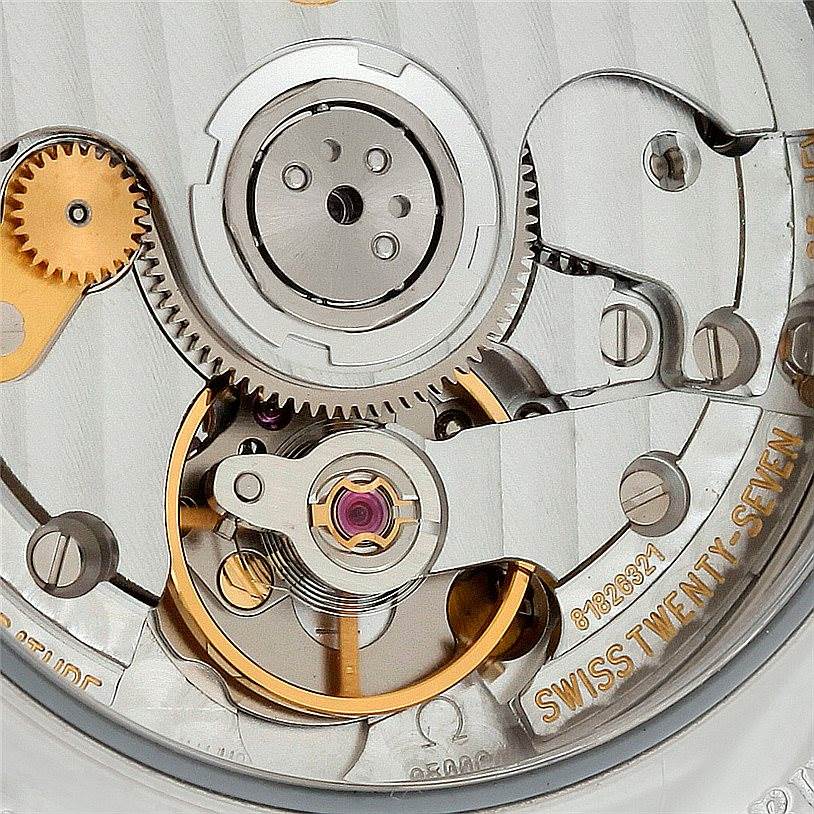 The image shows a close-up view of the movement mechanism inside an Omega Aqua Terra 2502.34.00 Men
s Stainless Steel Silver Dial 2502.34.00 Men
s Stainless Steel Silver Dial watch.