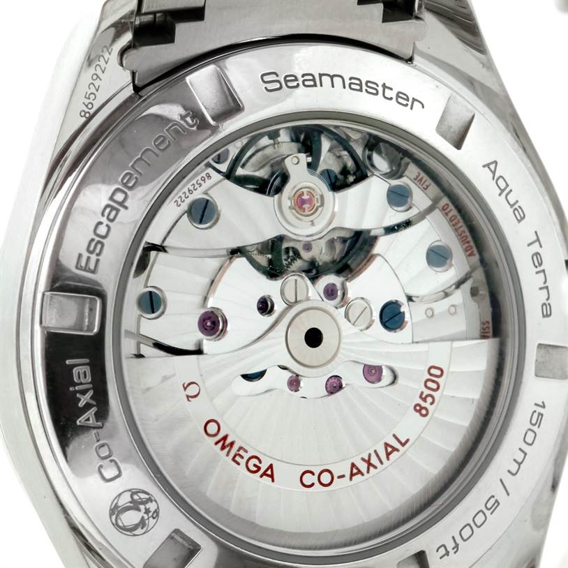 The image shows the back of the Omega Aqua Terra 231.10.42.21.03.001 Men
s Stainless Steel Blue Dial 231.10.42.21.03.001 Men
s Stainless Steel Blue Dial Seamaster watch, highlighting the Co-Axial movement mechanism.