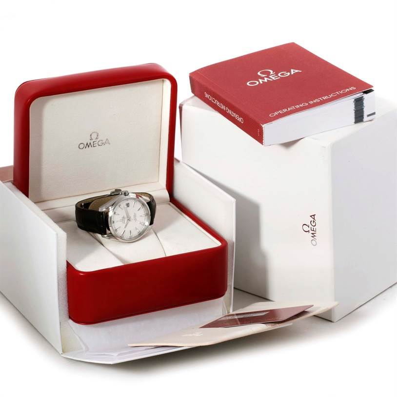 The Omega Aqua Terra 231.10.42.21.02.001 Men
s Stainless Steel Silver Dial 231.10.42.21.02.001 Men
s Stainless Steel Silver Dial watch is shown in its red box with an instruction manual and additional packaging materials nearby.