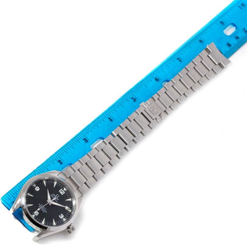 The image shows the Omega Aqua Terra 2503.52.00 Men
s Stainless Steel Black Dial 2503.52.00 Men
s Stainless Steel Black Dial watch and metal bracelet measured with a blue ruler, viewed from a top-down angle.