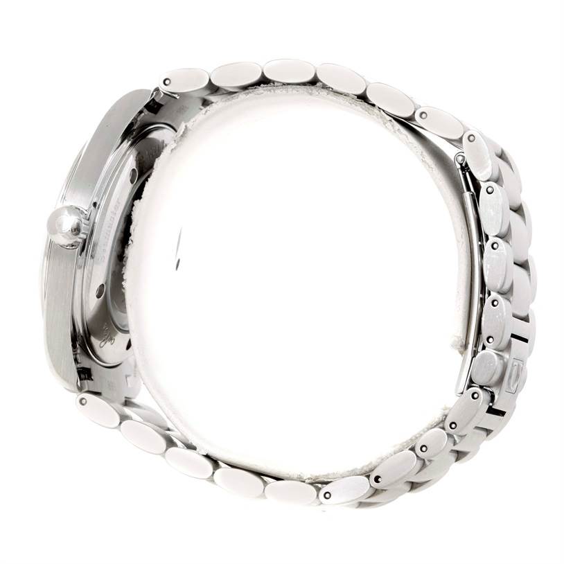 The image shows a side view of the Aqua Terra model by Omega, highlighting its crown and metal bracelet.