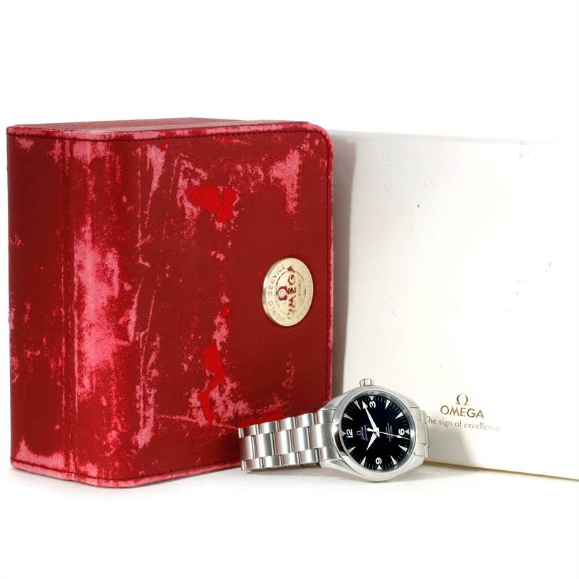This image shows an Omega Aqua Terra 2503.52.00 Men
s Stainless Steel Black Dial 2503.52.00 Men
s Stainless Steel Black Dial watch with its stainless steel bracelet, next to a red Omega box and a white booklet.