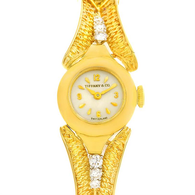 This image shows a frontal view of the face and part of the band of a Tiffany 4803 model 14k Yellow Gold Diamond Vintage Ladies Cocktail Watch.