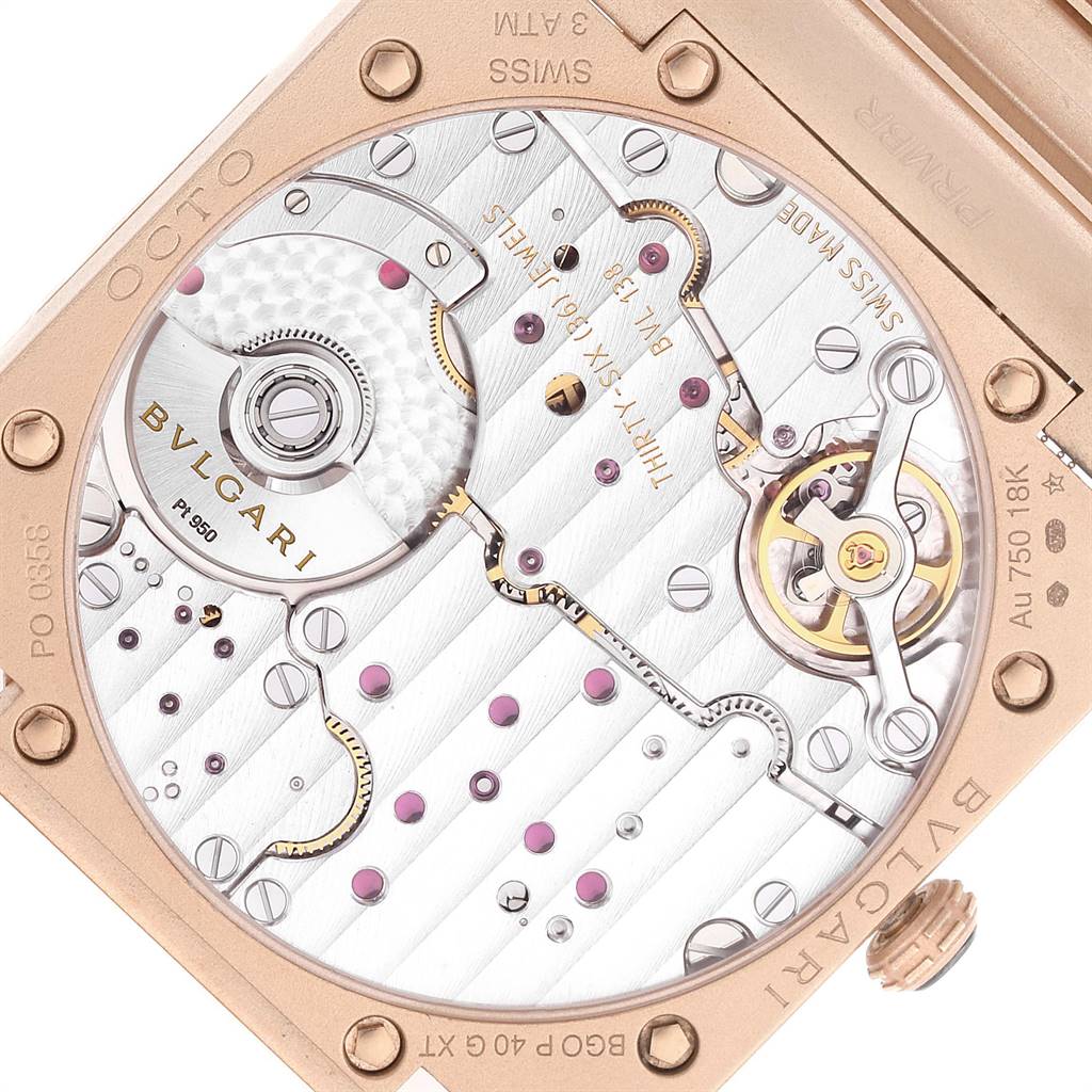 The image shows the back view of a Bvlgari Octo 102912 Men
s Rose Gold Pink Dial 102912 Men
s Rose Gold Pink Dial watch, highlighting its intricate automatic movement components.
