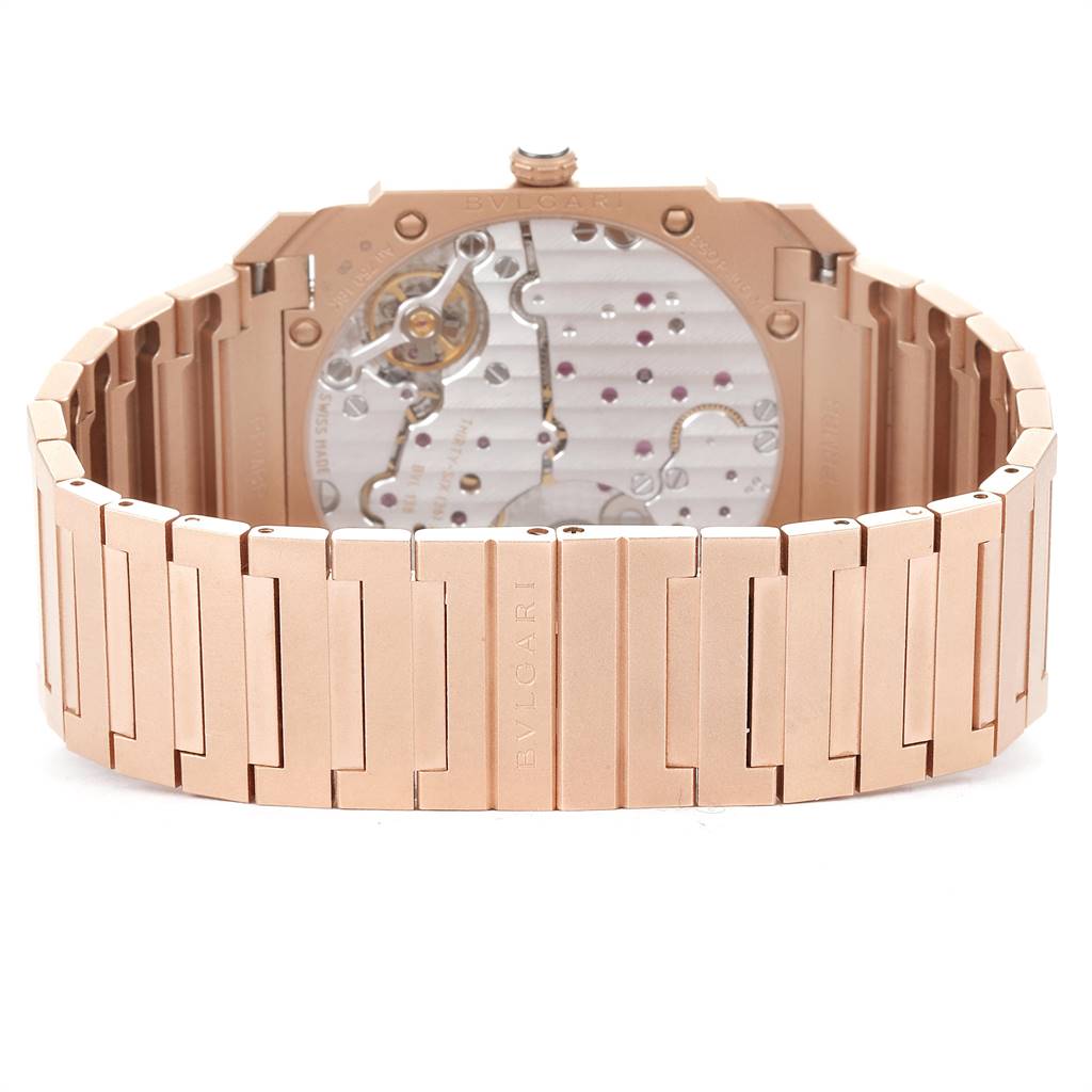 This image shows the back view of the Bvlgari Octo 102912 Men
s Rose Gold Pink Dial 102912 Men
s Rose Gold Pink Dial watch, highlighting its rose gold bracelet and intricate movement.