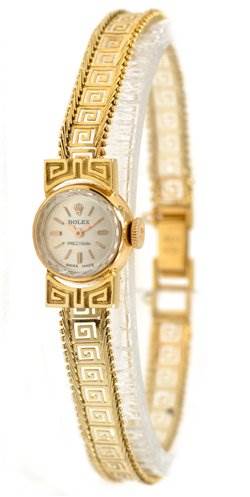 The image shows a Rolex Cocktail 2113 Women's Yellow Gold Silver Dial 2113 Women's Yellow Gold Silver Dial watch at an angle highlighting its intricate gold and silver band and small round dial.