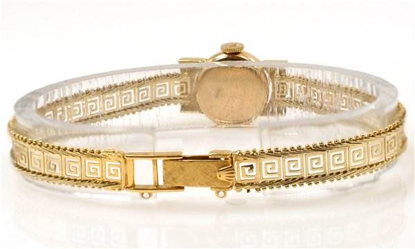 The image shows the back and clasp of the Rolex Cocktail 2113 Women's Yellow Gold Silver Dial 2113 Women's Yellow Gold Silver Dial model watch, highlighting its detailed bracelet design.