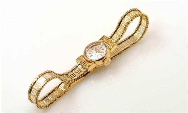 The image shows a top-down view of a Rolex Cocktail 2113 Women's Yellow Gold Silver Dial 2113 Women's Yellow Gold Silver Dial model watch, highlighting its intricate gold bracelet and round watch face.