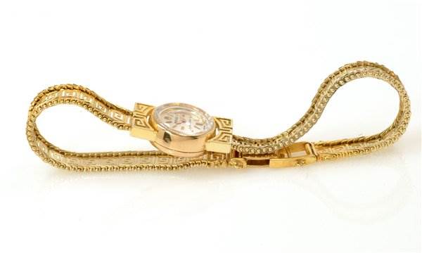 The image shows a side view of a Rolex Cocktail 2113 Women's Yellow Gold Silver Dial 2113 Women's Yellow Gold Silver Dial model watch, highlighting its gold case, bracelet, and clasp.