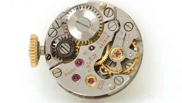 The image shows the internal mechanism of the Rolex Cocktail 2113 Women's Yellow Gold Silver Dial 2113 Women's Yellow Gold Silver Dial watch, viewed from the top down.