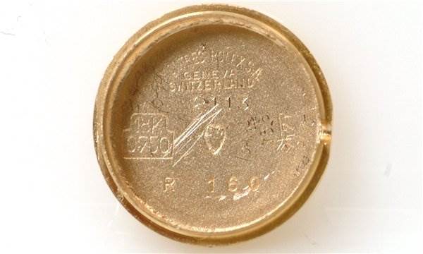 The image shows the inside case back of a Rolex Cocktail 2113 Women's Yellow Gold Silver Dial 2113 Women's Yellow Gold Silver Dial model watch, viewed directly from above.