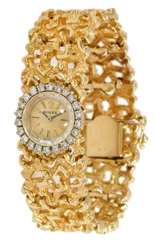 The image shows a frontal view of the Rolex Cocktail 2604 Women's Yellow Gold Champagne Dial 2604 Women's Yellow Gold Champagne Dial watch, highlighting its gold intricate band and diamond-encrusted bezel.