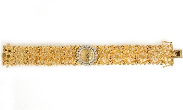 The image shows a top-down view of the Rolex Cocktail 2604 Women's Yellow Gold Champagne Dial 2604 Women's Yellow Gold Champagne Dial model watch, highlighting its intricate gold bracelet and round dial.