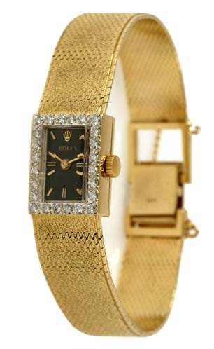 The image shows a Rolex Cocktail Women's Yellow Gold Black Dial Women's Yellow Gold Black Dial watch from a side angle, highlighting its rectangular face, mesh band, and crown.