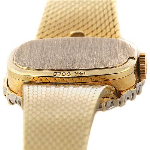 This image shows the back and side angle of a Rolex Cocktail 8365 Women's Yellow Gold Champagne Dial 8365 Women's Yellow Gold Champagne Dial model watch, highlighting its 14K gold case and crown.