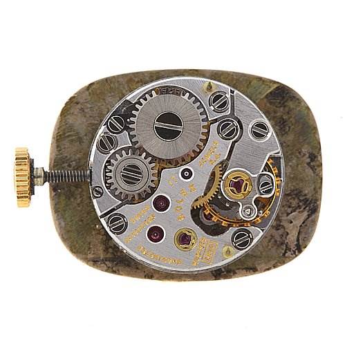 This image shows the internal mechanism of a Rolex Cocktail 8365 Women's Yellow Gold Champagne Dial 8365 Women's Yellow Gold Champagne Dial model watch, viewed from the rear.