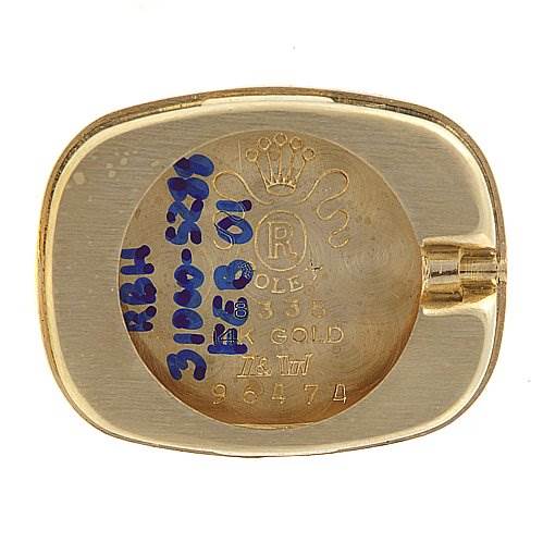 The image shows the back case of a Rolex Cocktail 8365 Women's Yellow Gold Champagne Dial 8365 Women's Yellow Gold Champagne Dial model watch, displaying engravings and a gold finish.