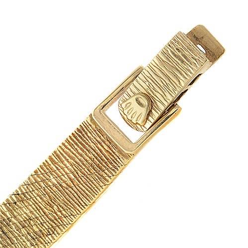 This image shows a close-up of the clasp and part of the bracelet of a Rolex Cocktail 8365 Women's Yellow Gold Champagne Dial 8365 Women's Yellow Gold Champagne Dial model watch.