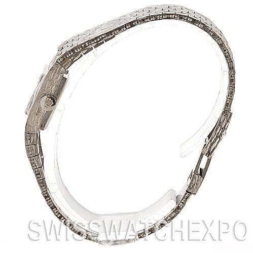 The image shows a Rolex Cocktail 2189 Women's White Gold Silver Dial 2189 Women's White Gold Silver Dial watch from a side angle, highlighting its slim profile and intricate bracelet design.