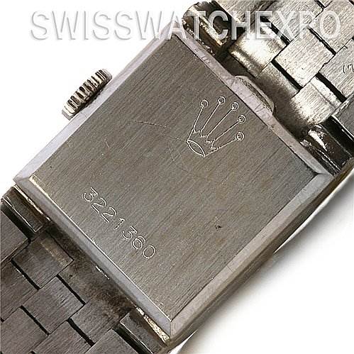 This image shows the case back and partial bracelet of a Rolex Cocktail 2189 Women's White Gold Silver Dial 2189 Women's White Gold Silver Dial model watch, engraved with the Rolex logo and serial number.
