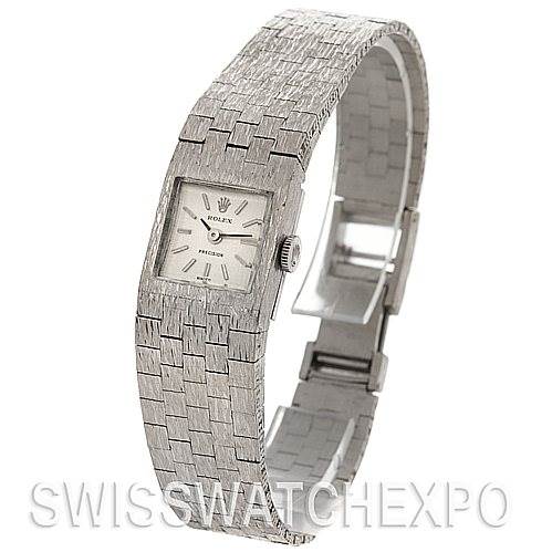 The image shows a Rolex Cocktail 2189 Women's White Gold Silver Dial 2189 Women's White Gold Silver Dial model watch from an oblique angle, highlighting its rectangular face and textured bracelet.