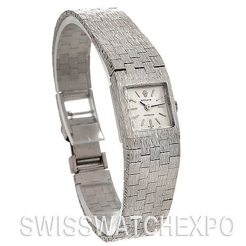 This image shows a side angle of the Rolex Cocktail 2189 Women's White Gold Silver Dial 2189 Women's White Gold Silver Dial model watch, highlighting its bracelet, rectangular case, and clasp.