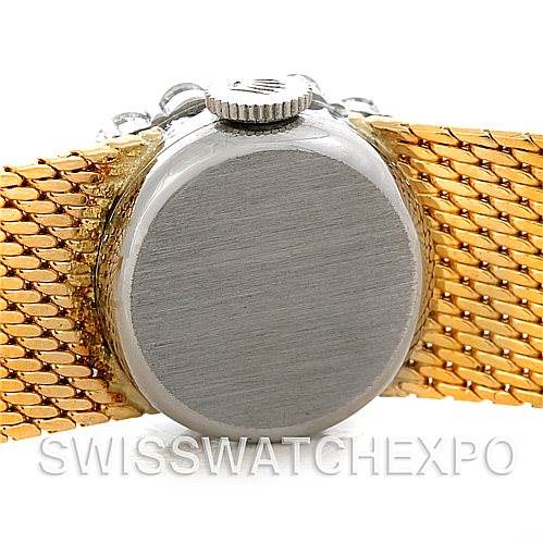 This image shows the back case and crown of a Rolex Cocktail Women's Yellow Gold Silver Dial Women's Yellow Gold Silver Dial model watch, taken from a rear angle.