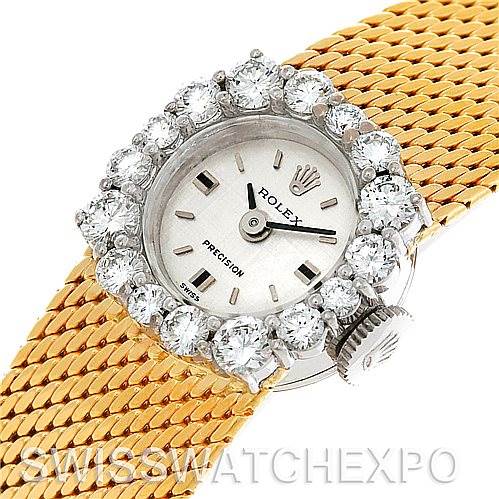 This image shows a Rolex Cocktail Women's Yellow Gold Silver Dial Women's Yellow Gold Silver Dial model watch angled to display its face, bezel with diamonds, and part of the gold mesh strap.