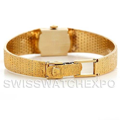 The Rolex Cocktail 4281 Women's Yellow Gold Champagne Dial 4281 Women's Yellow Gold Champagne Dial model watch is shown from the back angle, highlighting its gold textured bracelet and clasp.