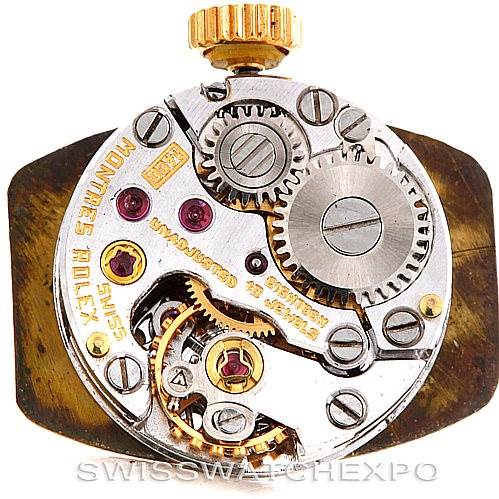 This image shows the intricate inner mechanism of a Rolex Cocktail 8422 Women's Yellow Gold Champagne Dial 8422 Women's Yellow Gold Champagne Dial model watch, viewed from the back, highlighting the gears and cogs.