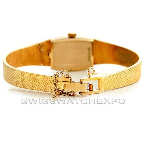 The image shows a rear view of the Rolex Cocktail 8422 Women's Yellow Gold Champagne Dial 8422 Women's Yellow Gold Champagne Dial watch, highlighting its gold-tone bracelet, clasp, and safety chain.