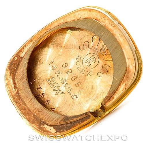 The image shows the inner case back and markings of a Rolex Cocktail Women's Yellow Gold Silver Dial Women's Yellow Gold Silver Dial model watch.