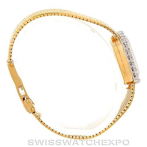 The image shows a side view of the Rolex Cocktail Women's Yellow Gold Silver Dial Women's Yellow Gold Silver Dial model watch, featuring its gold bracelet and case.