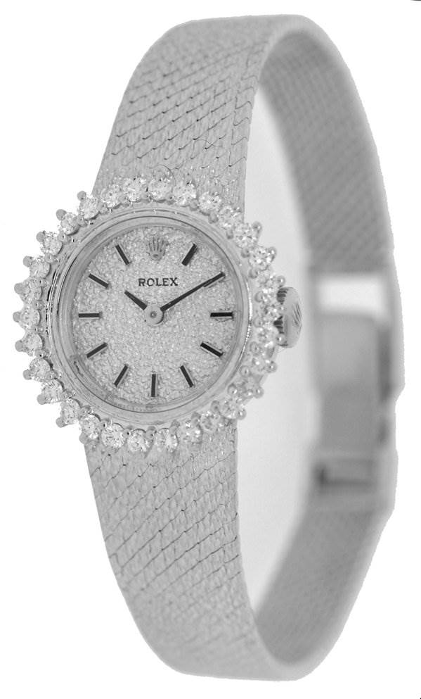 The image shows a Rolex Cocktail 8032 Women's White Gold Silver Dial 8032 Women's White Gold Silver Dial model watch from a front angle, highlighting the dial, bezel, and part of the strap.