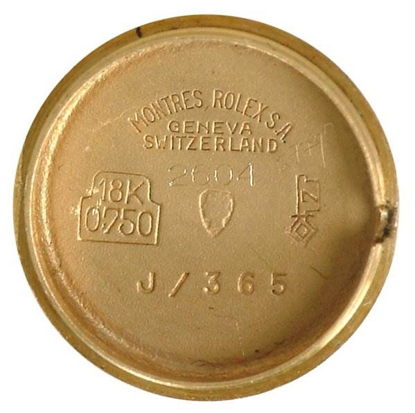 This image shows the interior of the case back for a Rolex Cocktail 2604 Women's Yellow Gold Silver Dial 2604 Women's Yellow Gold Silver Dial model watch.