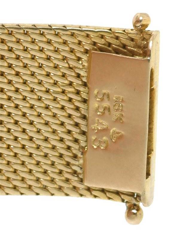 The image shows a close-up of the gold mesh bracelet and clasp of the Rolex Cocktail 2604 Women's Yellow Gold Silver Dial 2604 Women's Yellow Gold Silver Dial model watch.