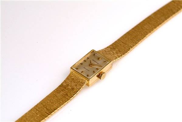 The Rolex Cocktail 173J Women's Yellow Gold Silver Dial 173J Women's Yellow Gold Silver Dial watch is shown from a slightly angled top view, displaying the face and band.