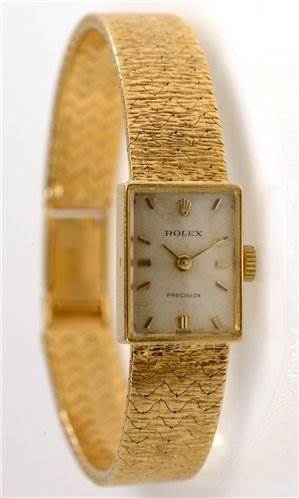 The image shows a Rolex Cocktail 173J Women's Yellow Gold Silver Dial 173J Women's Yellow Gold Silver Dial model watch at an angled front view, highlighting its bracelet, square dial, and crown.