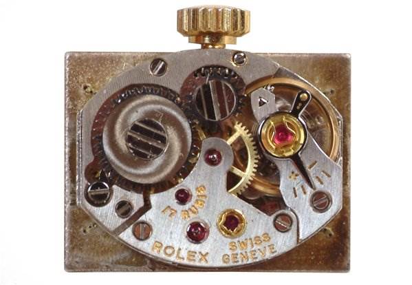 The image shows the internal mechanism of the Rolex Cocktail 173J Women's Yellow Gold Silver Dial 173J Women's Yellow Gold Silver Dial model watch viewed from above.