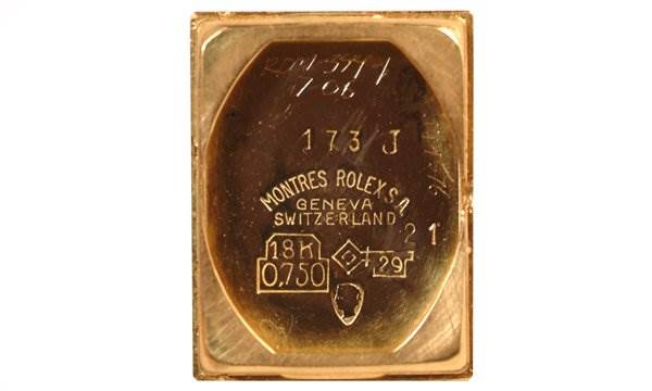 This image shows the back cover of a Rolex Cocktail 173J Women's Yellow Gold Silver Dial 173J Women's Yellow Gold Silver Dial model watch, highlighting its engravings and markings.