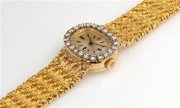 This image shows the dial and bracelet of a gold Rolex Cocktail 231 Women's Yellow Gold Silver Dial 231 Women's Yellow Gold Silver Dial model watch at an oblique angle.