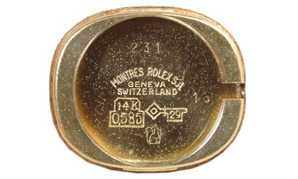 The image shows the inside case back of a Rolex Cocktail 231 Women's Yellow Gold Silver Dial 231 Women's Yellow Gold Silver Dial model, featuring brand markings and gold purity stamps.