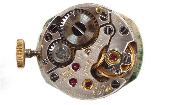 This image shows the internal mechanism of a Rolex Cocktail 231 Women's Yellow Gold Silver Dial 231 Women's Yellow Gold Silver Dial model watch, viewed from the back.