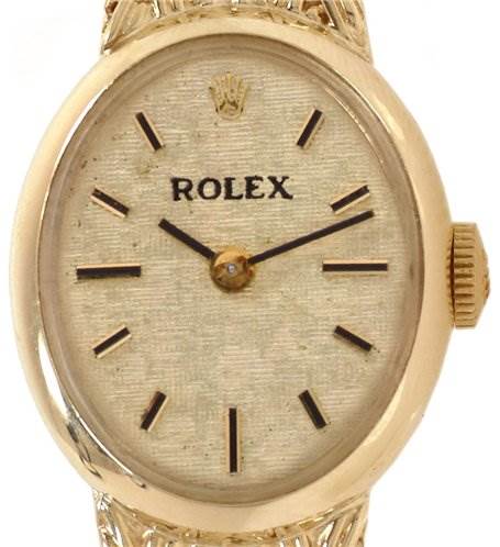 The image shows a front view of the Rolex Cocktail 8415 Women's Yellow Gold Champagne Dial 8415 Women's Yellow Gold Champagne Dial model watch, displaying the dial, crown, and part of the bracelet.