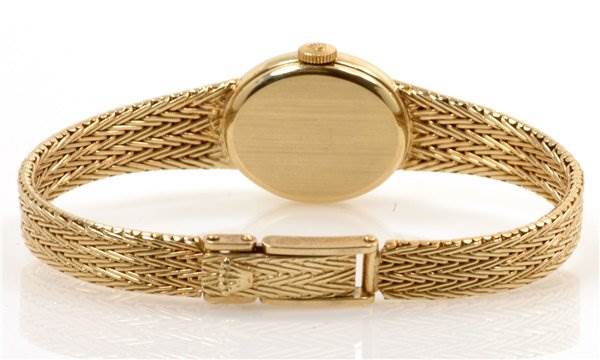 This image shows a rear angle of the Rolex Cocktail 8415 Women's Yellow Gold Champagne Dial 8415 Women's Yellow Gold Champagne Dial watch, highlighting its band and clasp.