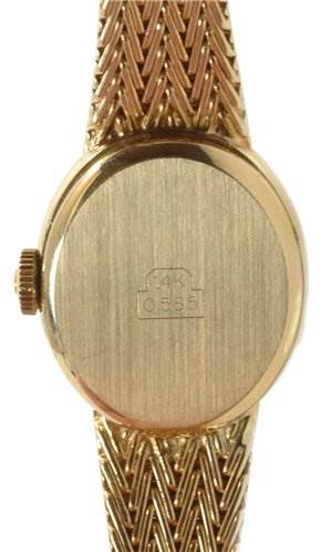 This image shows the back case and part of the bracelet of a Cocktail model by Rolex from a straight-on angle.