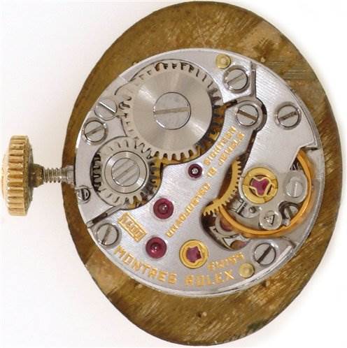 The image shows the internal mechanism of the Rolex Cocktail 8415 Women's Yellow Gold Champagne Dial 8415 Women's Yellow Gold Champagne Dial model watch, viewed from the back.
