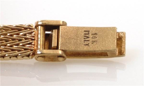 The image shows a close-up of the clasp part of the Rolex Cocktail 8415 Women's Yellow Gold Champagne Dial 8415 Women's Yellow Gold Champagne Dial model watch bracelet.